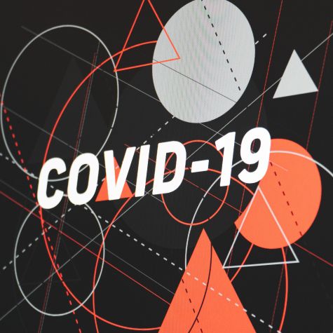 Die Aufnahme zeigt eine futuristische Abbildung geometrischer Formen mit dem Schriftzug "Covid-19"