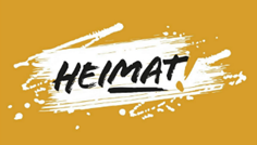 Die Aufnahme zeigt den Schriftzug „Heimat“ vor grünem Hintergrund Die Aufnahme zeigt den Schriftzug „Heimat“ vor grünem Hintergrund