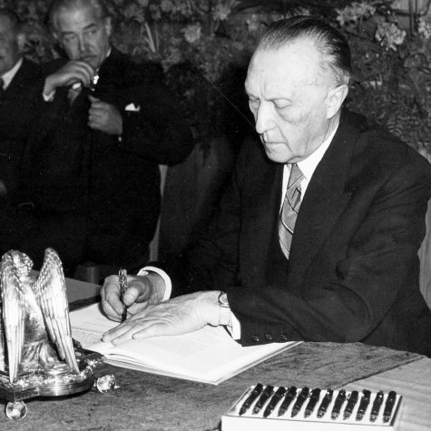 The archive photo shows the President of the Parliamentary Council, Dr. Konrad Adenauer, signing the Basic Law in Bonn at precisely 5 p.m. on May 23, 1949. 