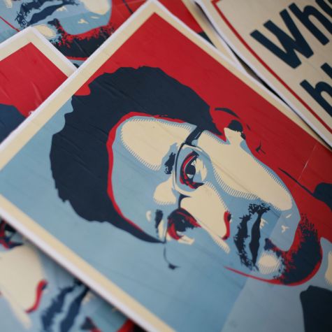 The photograph shows small banners bearing the likeness of whistleblower Edward Snowden. They were used during a demonstration in front of the Federal Chancellery on July 4, 2013.