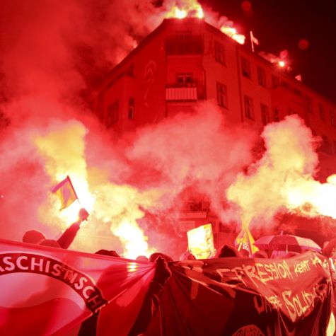 The photo shows Bengal fires during a left-wing radical demonstration in memory of the squatter Silvio Meier, who was murdered by neo-Nazis in 1992, in Rigaer Straße in Berlin