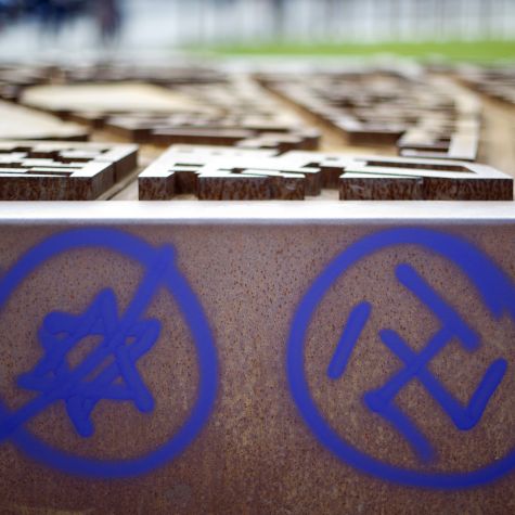 This photo taken on June 9, 2013 shows a swastika and a crossed-out Star of David at a memorial site at the Nordbahnhof train station in Berlin.